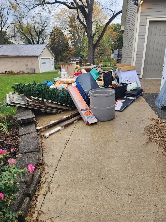 Dumpster being loaded with debris for 30 Yard Dumpster Rental in Big Stone Gap